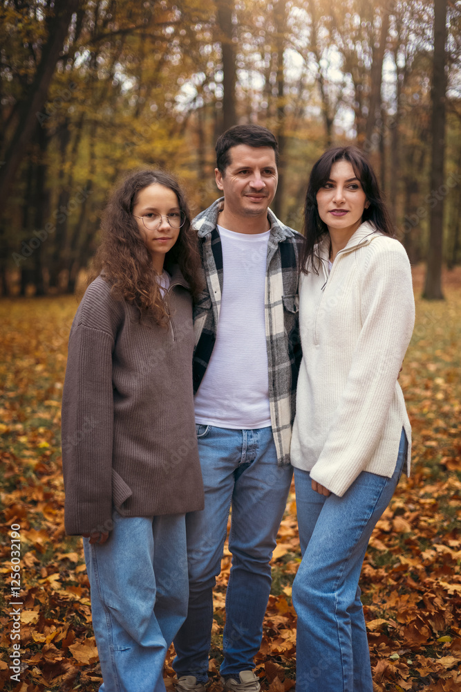 Family enjoying the warmth and colors of autumn outdoors Family enjoying the warmth and colors of autumn outdoors