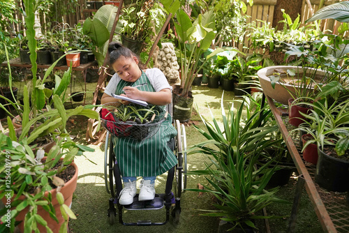 Disabled woman working at plant nursery photo