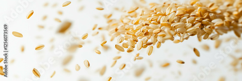 Motion blur captures the beauty of rice grains being threshed on a bright background