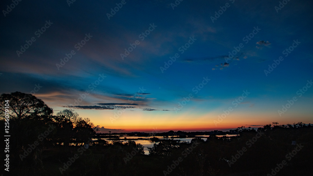 Fototapeta premium Dramatical intense dawn sky greets the day over Cedar Key Florida