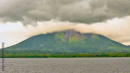 Ometepe volcano in Lake Nicaragua covered in clouds photo