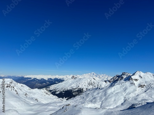 snow covered mountains in winter val thorens french alps photo