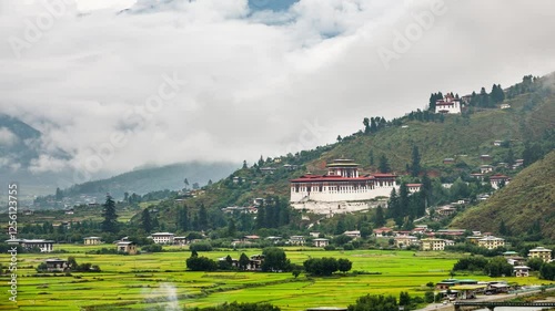 Looking out over the city of Paro in Bhutan. The Rinpung Dzong can be seen. Time Lapse. photo