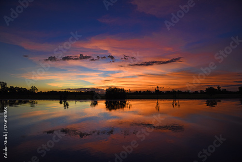 spectacularly and colorful sunset at Yellow Waters Billabong, Kakadu National Park, Northern Territory, Australia photo