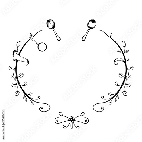 Floral frame design with spoons and scissors.