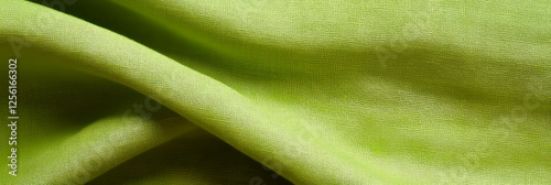 Light lime green cotton fabric with poplin weave showcasing smooth texture and clarity