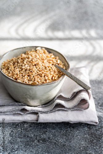 A bowl filled with chopped hazelnuts photo