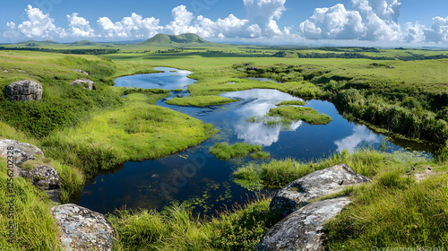 Serene highland wetland reflecting clouds, distant hills. Nature landscape for travel brochures