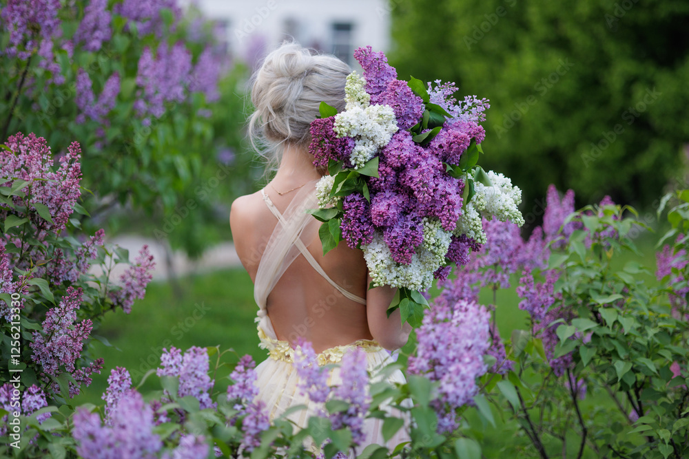 A dreamy woman in an elegant dress holds a lush lilac bouquet, surrounded by blooming flowers in a romantic garden—capturing beauty, femininity, and nature’s charm A dreamy woman in an elegant dress holds a lush lilac bouquet, surrounded by blooming flowers in a romantic garden—capturing beauty, femininity, and nature’s charm