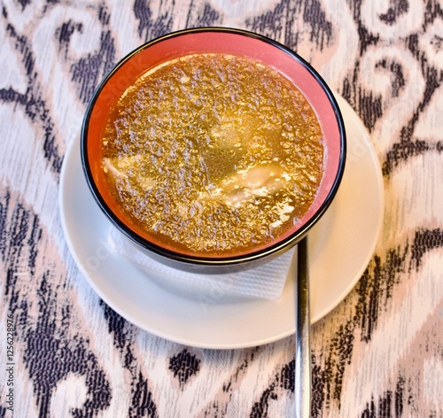 national Armenian beef hash soup - pickled red onion, garlic in oil and lavash dried in the oven photo