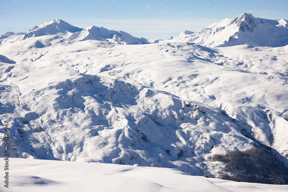 Pristine Winter Landscape of Rolling Snowfields. Les Menuires. French Alps. France Pristine Winter Landscape of Rolling Snowfields. Les Menuires. French Alps. France