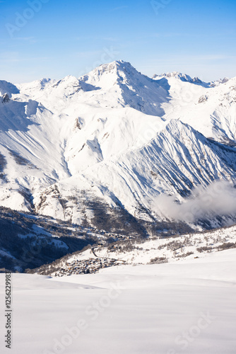 Photography Winter Landscape of the Alps with untouched snowfields in the foreground and Low-Hanging Clouds