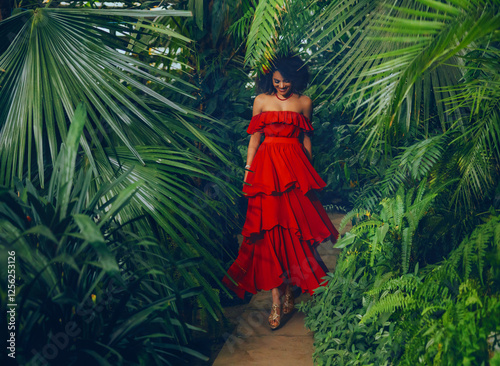 фотографія art photo real person Fantasy girl happy African american woman walking in tropical nature forest green palm tree jungle