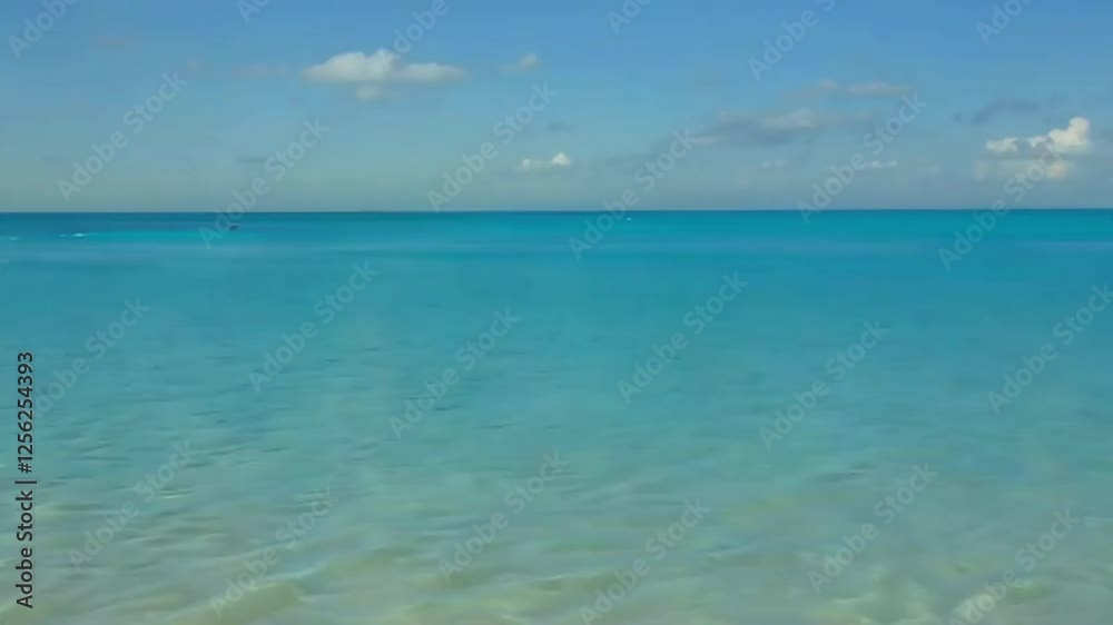 Serene turquoise ocean vista under a partly cloudy sky, summer background, summer vacatios. Serene turquoise ocean vista under a partly cloudy sky, summer background, summer vacatios.
