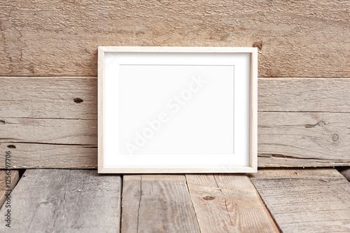 Wooden frame 8x10 on wooden background. Ideal for displaying your artwork.