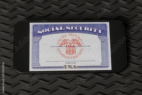 Social Security card blank on a smartphone. The Social Security Administration oversees retirement, disability, and survivors benefits. photo