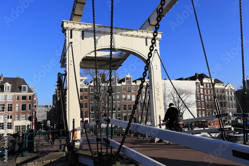 Amsterdam Skinny Bridge View with Cyclist, Netherlands photo