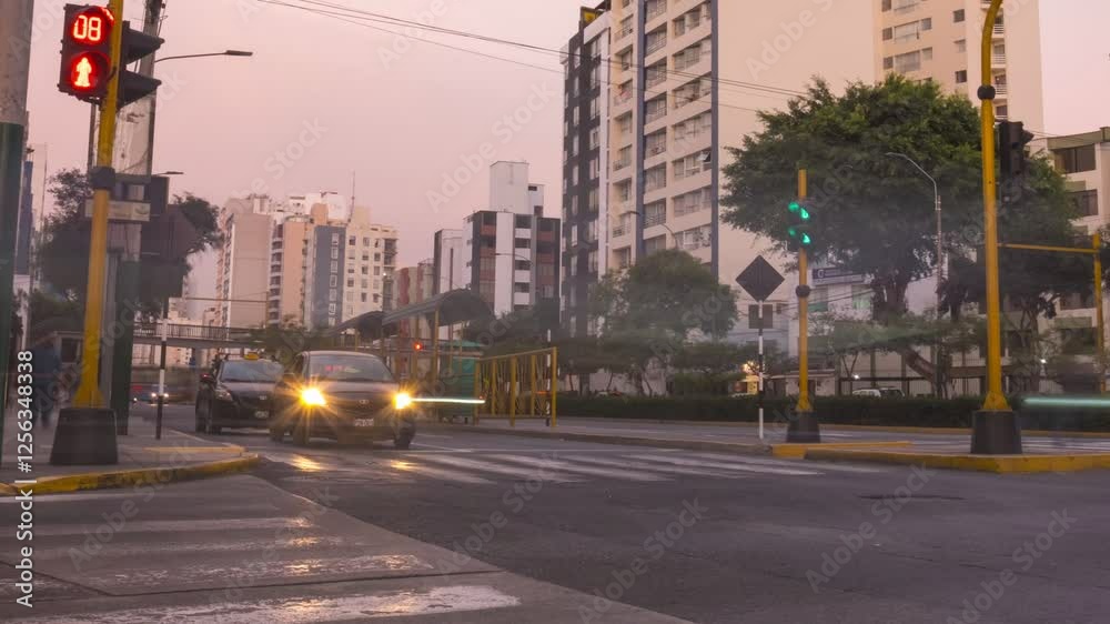 Lima, Peru. January 8, 2025. Timelapse sunset view of rush hour traffic in crossing on Av Brasil, Lima, Peru.