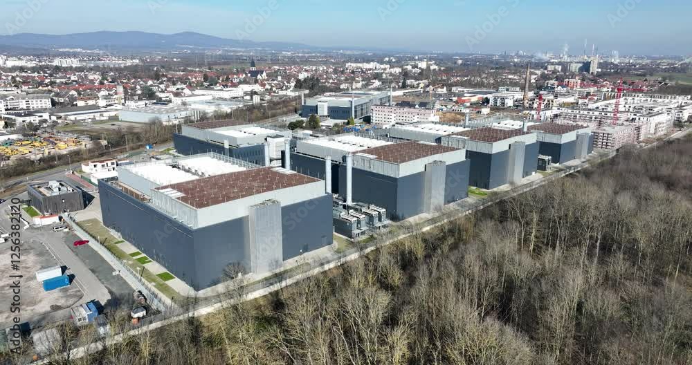 Aerial views on the FRA 4 data centers in Germany. Intenret infrastructure, cloud computing and information technology.