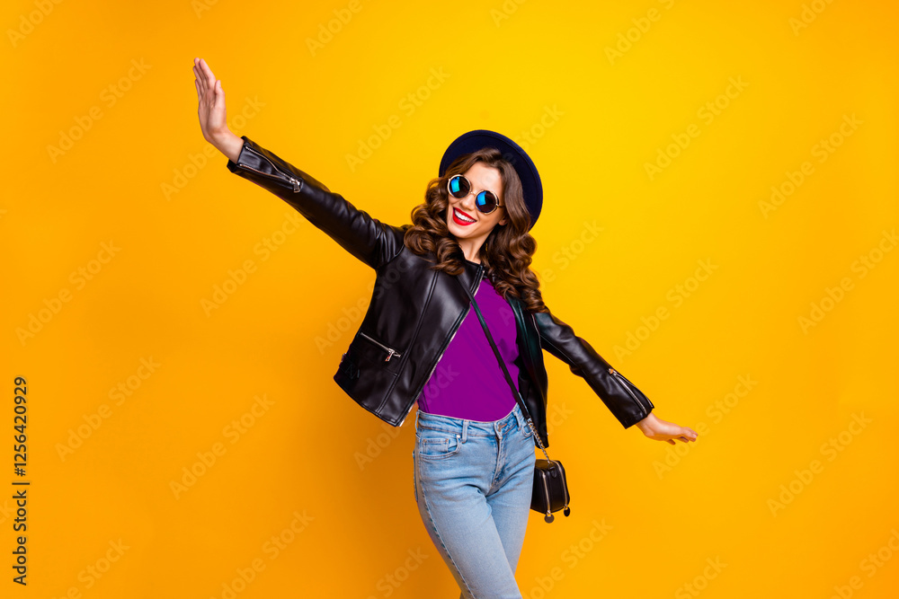 Obraz premium Photo of funny lady spread hands pretending air flight to warm countries wear casual outfit isolated yellow background