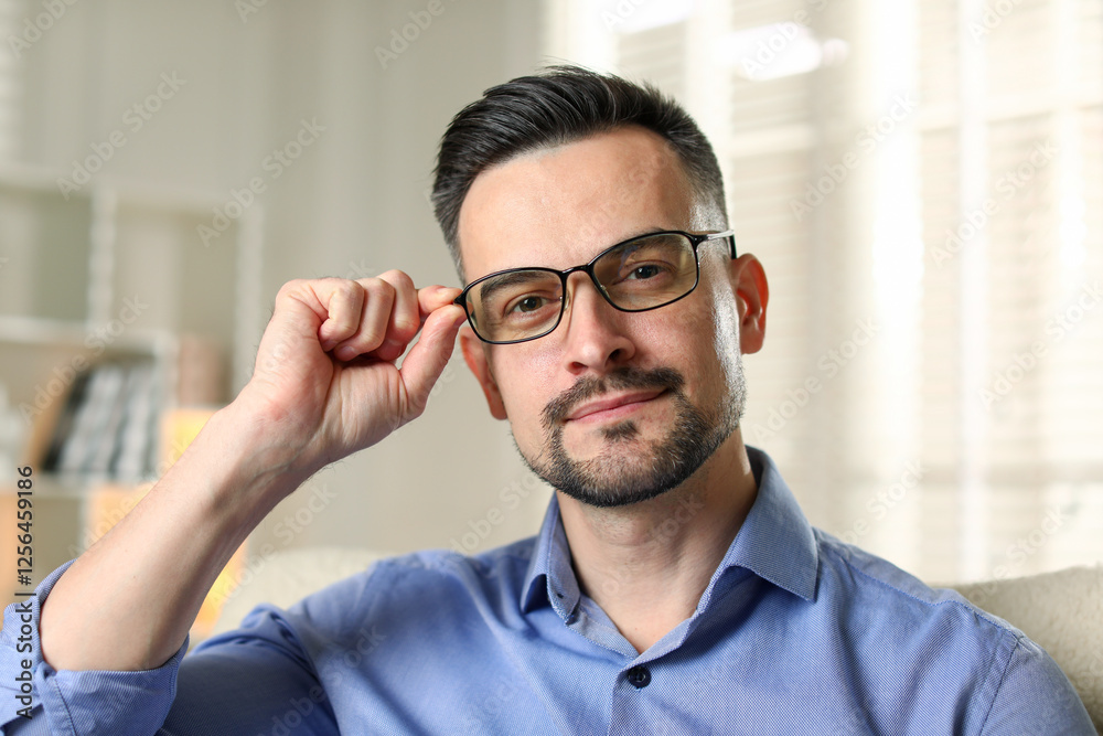 Obraz premium Portrait of handsome middle aged man indoors