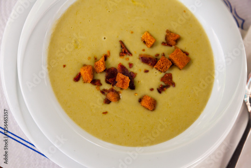 Healthy delicious lunch. Dietary cream soup of vegetables garnished with toasted bread .. photo