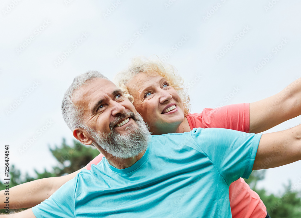 outdoor mature fitness woman man love active fun piggyback exercise healthy mid adult handsome confident fit sport adult couple mature exercising outdoor mature fitness woman man love active fun piggyback exercise healthy mid adult handsome confident fit sport adult couple mature exercising