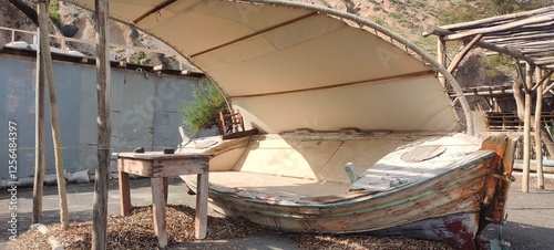 table and bed in the form of a boat on one of the beaches based on Santorini Greece