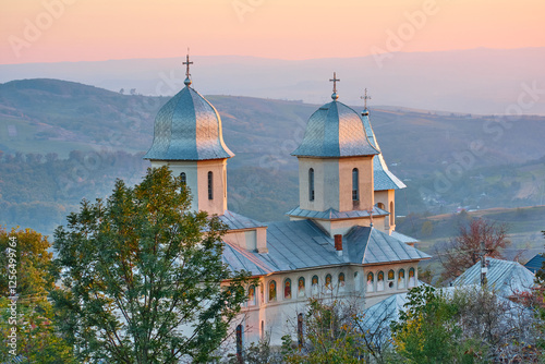 Obraz na płótnie Christian church in the evening at sunset w salonie