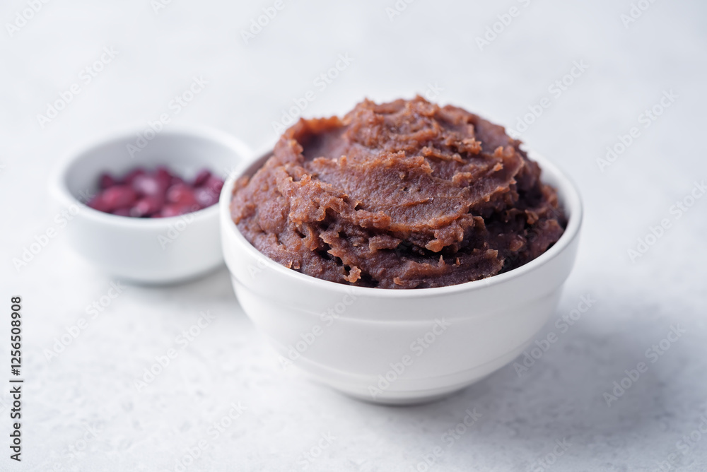 Sweet red bean paste, anko in a white bowl Sweet red bean paste, anko in a white bowl