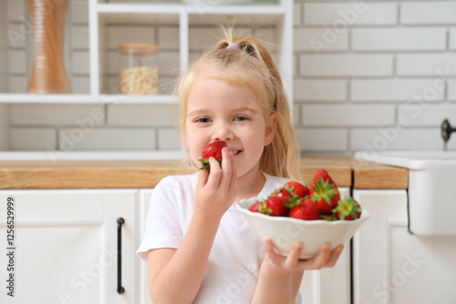 Little girl eating deliciou...