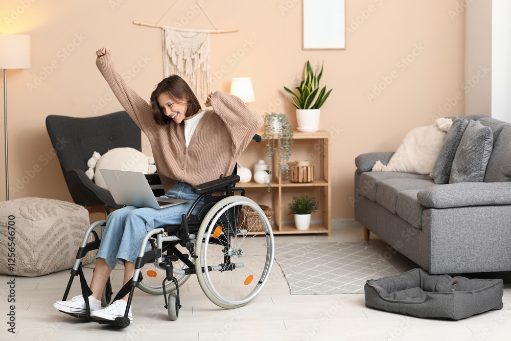 Young pretty woman in wheelchair with modern laptop at home Young pretty woman in wheelchair with modern laptop at home
