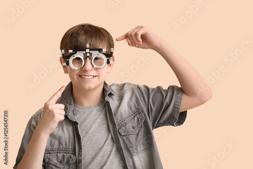 Little boy pointing at opti...