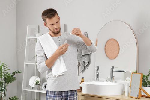 Bearded young man with seru...