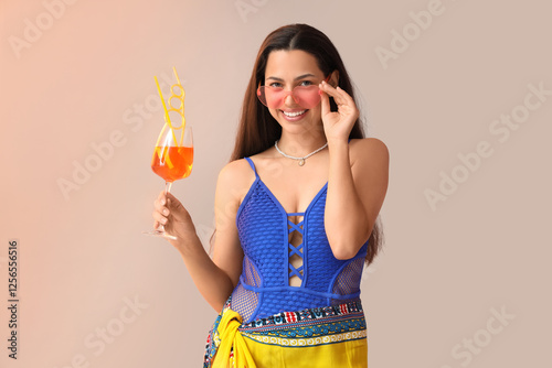 Young woman in swimsuit wit...