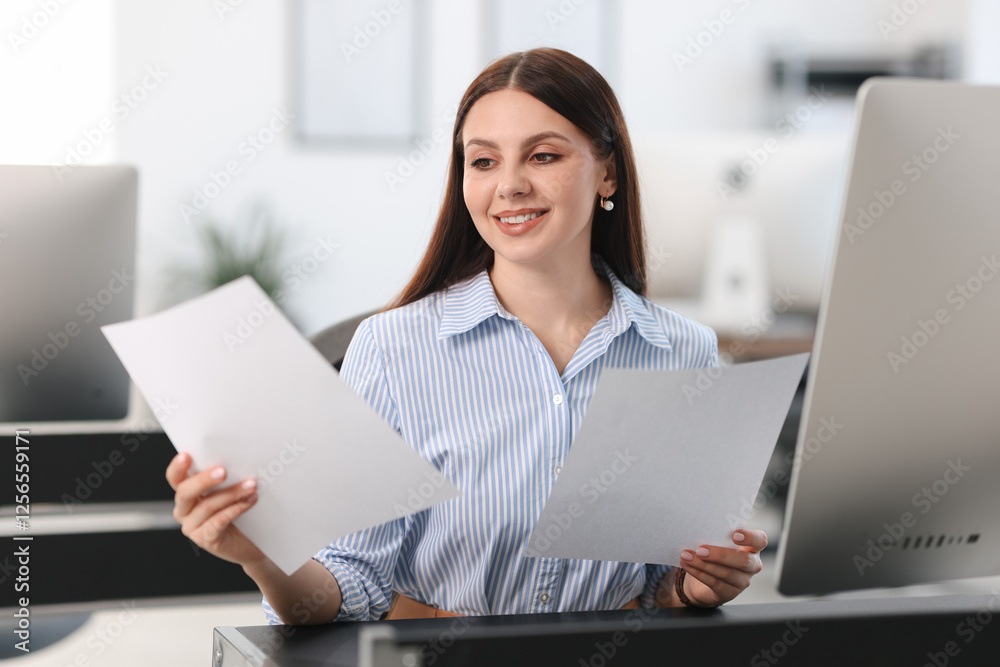 Banker with documents at desk in office Banker with documents at desk in office