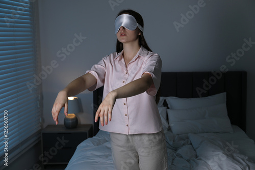 Young woman suffering from sleepwalking at home
