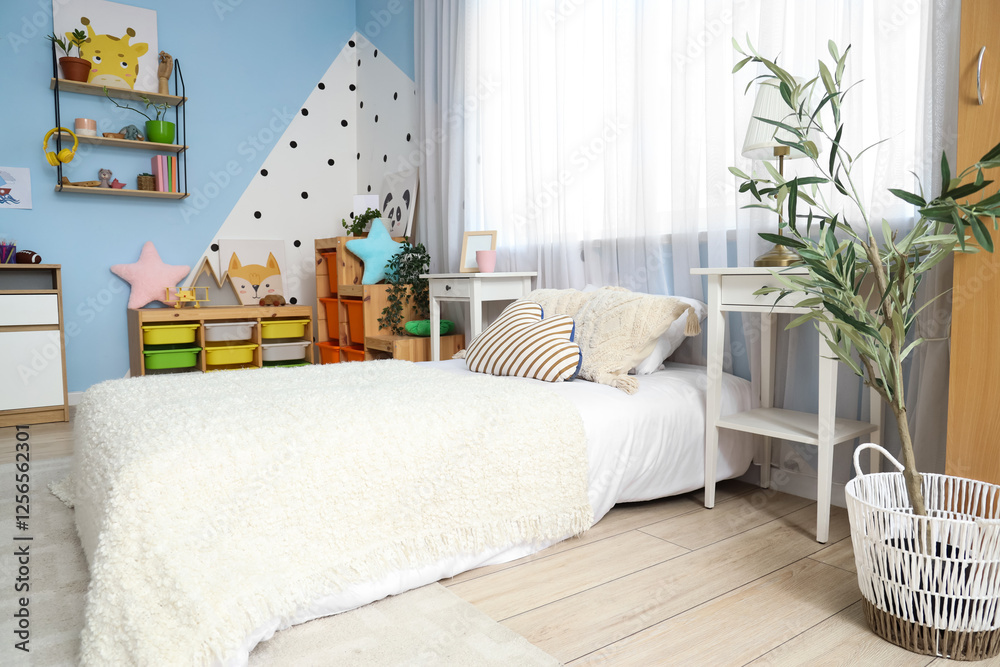 Φωτογραφία Interior of children's room with bed, tables and toys