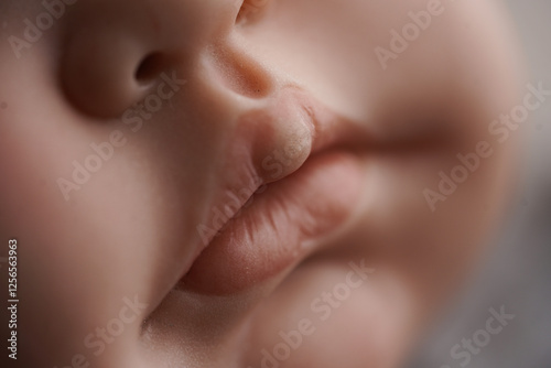 A hyper-realistic close-up of a doll's face, showcasing lifelike skin texture and soft lips. The fine details and gentle lighting create an illusion of realism, making it almost indistinguishable from