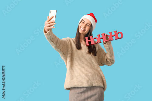 Happy young woman in Santa ...