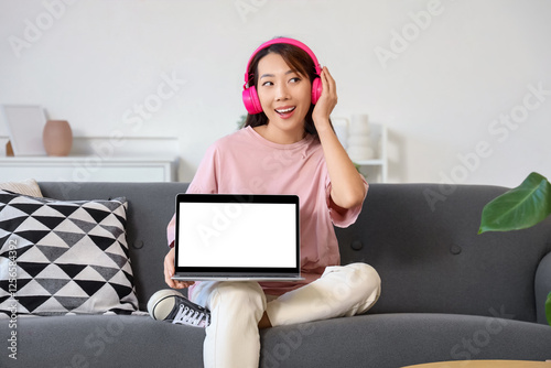 Young Asian woman with lapt...