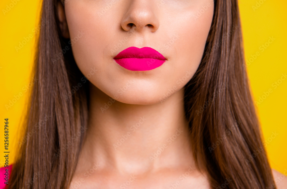 Close up half face portrait of confident brunette woman with red lips isolated on vivid yellow background Close up half face portrait of confident brunette woman with red lips isolated on vivid yellow background