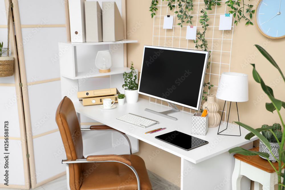 Interior of office with workplace, tablet and computer Interior of office with workplace, tablet and computer