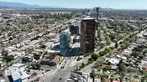 Beverly Hills San Vicente and Wilshire Blvd Aerial Shot Forward Tilt Up California USA
