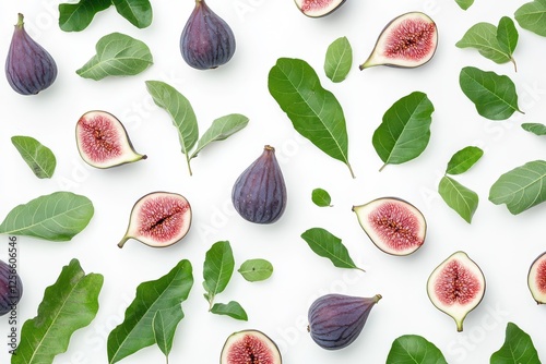 Isolated fig fruits and leaves with sliced figs on a white background photo