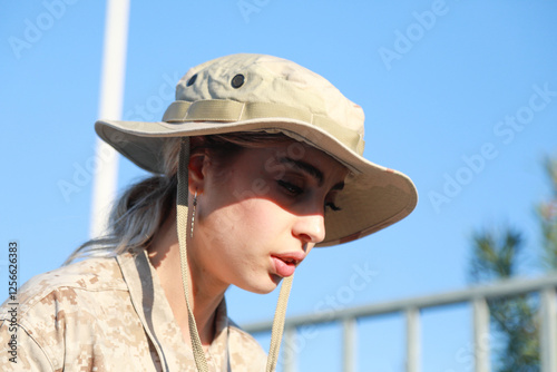 Tired And Bored Soldier Sitting On A Bench 