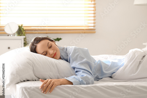 Young woman sleeping on pil...