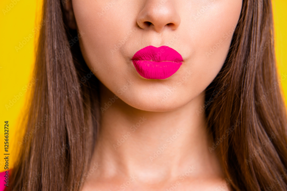 Close up half face portrait of young woman with red lips sand a kiss isolated on bright yellow background Close up half face portrait of young woman with red lips sand a kiss isolated on bright yellow background
