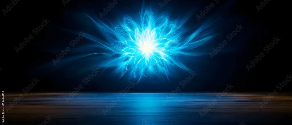 Obraz premium A stunning blue abstract light burst creates a mesmerizing visual effect against a dark background.