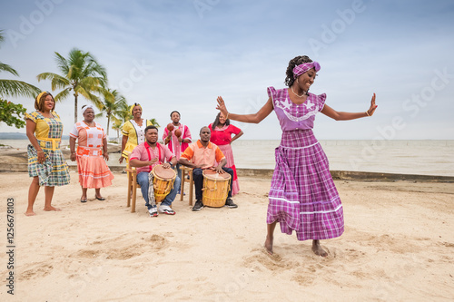 Beautiful Garifuna girl dances on the tips of her toes.